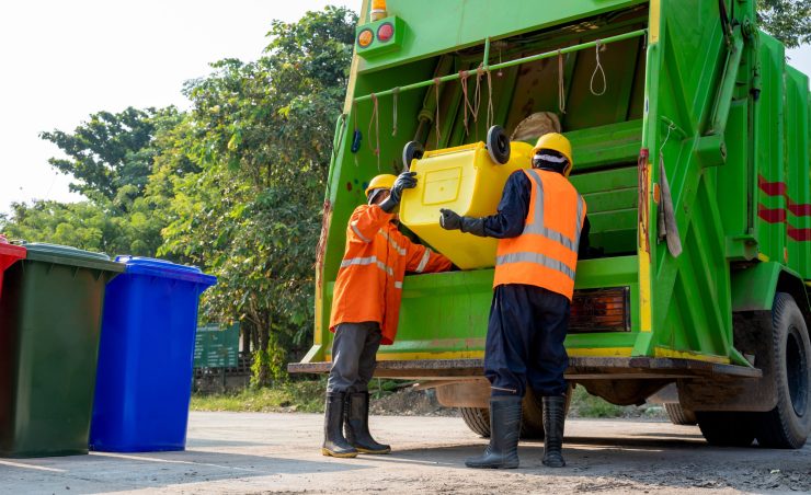 Workers collect garbage with Garbage collection truck,Concept of cleanliness and prevention of germs.